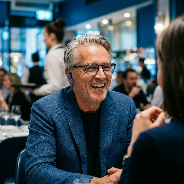 Older adult in noisy restaurant